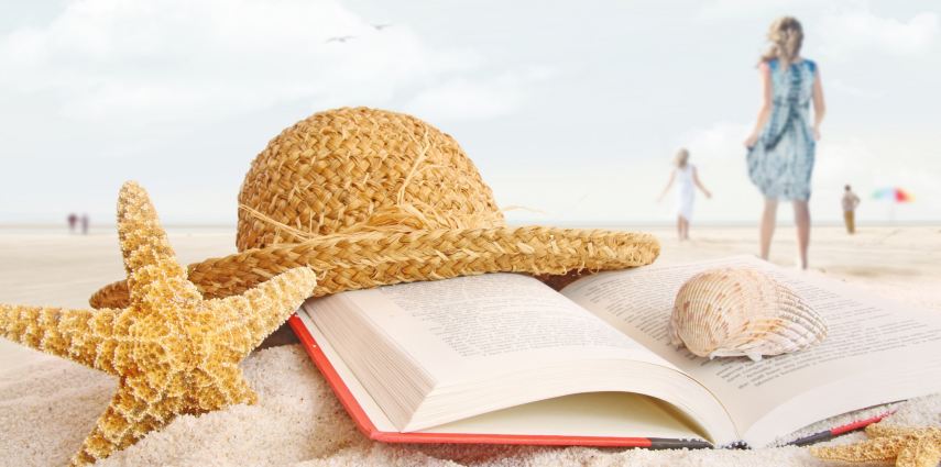 <p>Straw hat , book and seashells on the beach with people walking</p>
